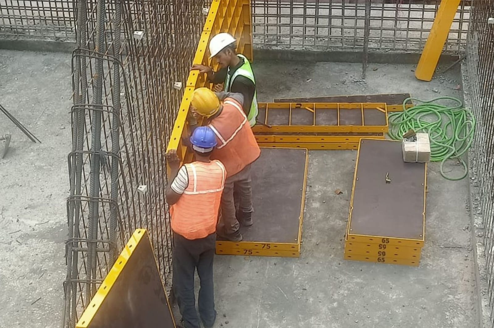Site engineer checking formwork at the SSC Plant